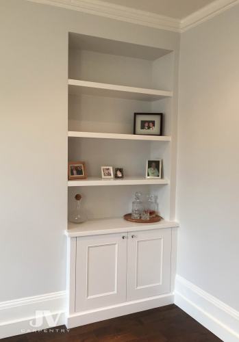 alcove fitted cabinet with floating shelves