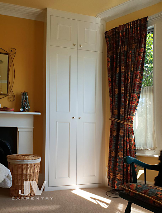 Made-to-measure wardrobe inside the left alcove. This wardrobe designed to fit perfectly into existing alcove. Fitted wardrobe made from floor to the ceiling