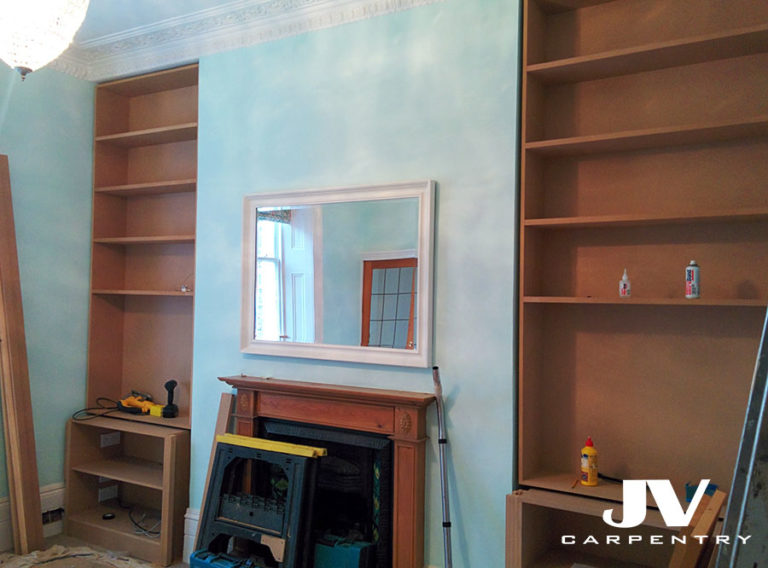 Fitting MDF alcove bookcases above the cupboards. 