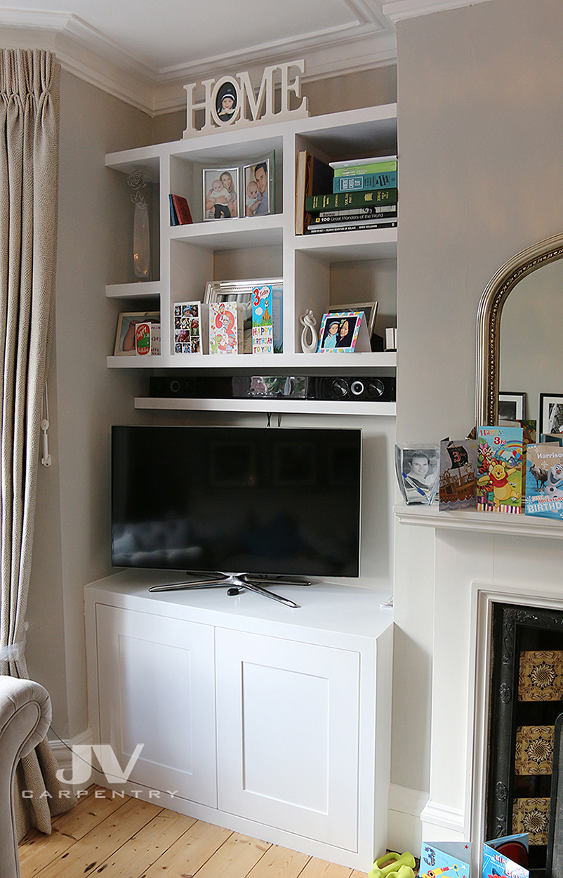Alcove tv cabinet with floating shelves above