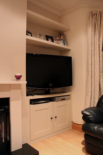 alcove tv cupboard and floating shelves