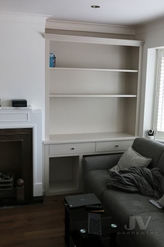 alcove unit with drawers and log store