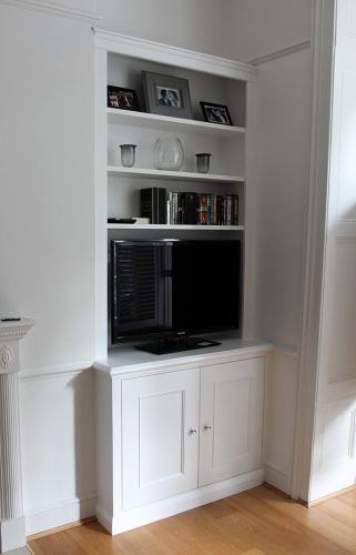 Fitted bookcase with cupboard