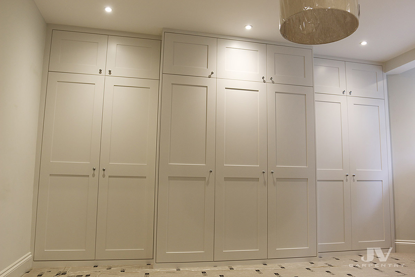 Built-in wardrobe fitted around the chimney breast