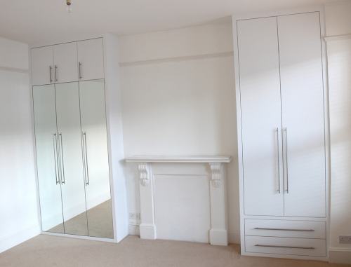 Fitted wardrobes with flush mirrored doors