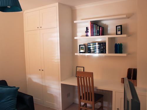Fitted wardrobe with floating shelves and desk