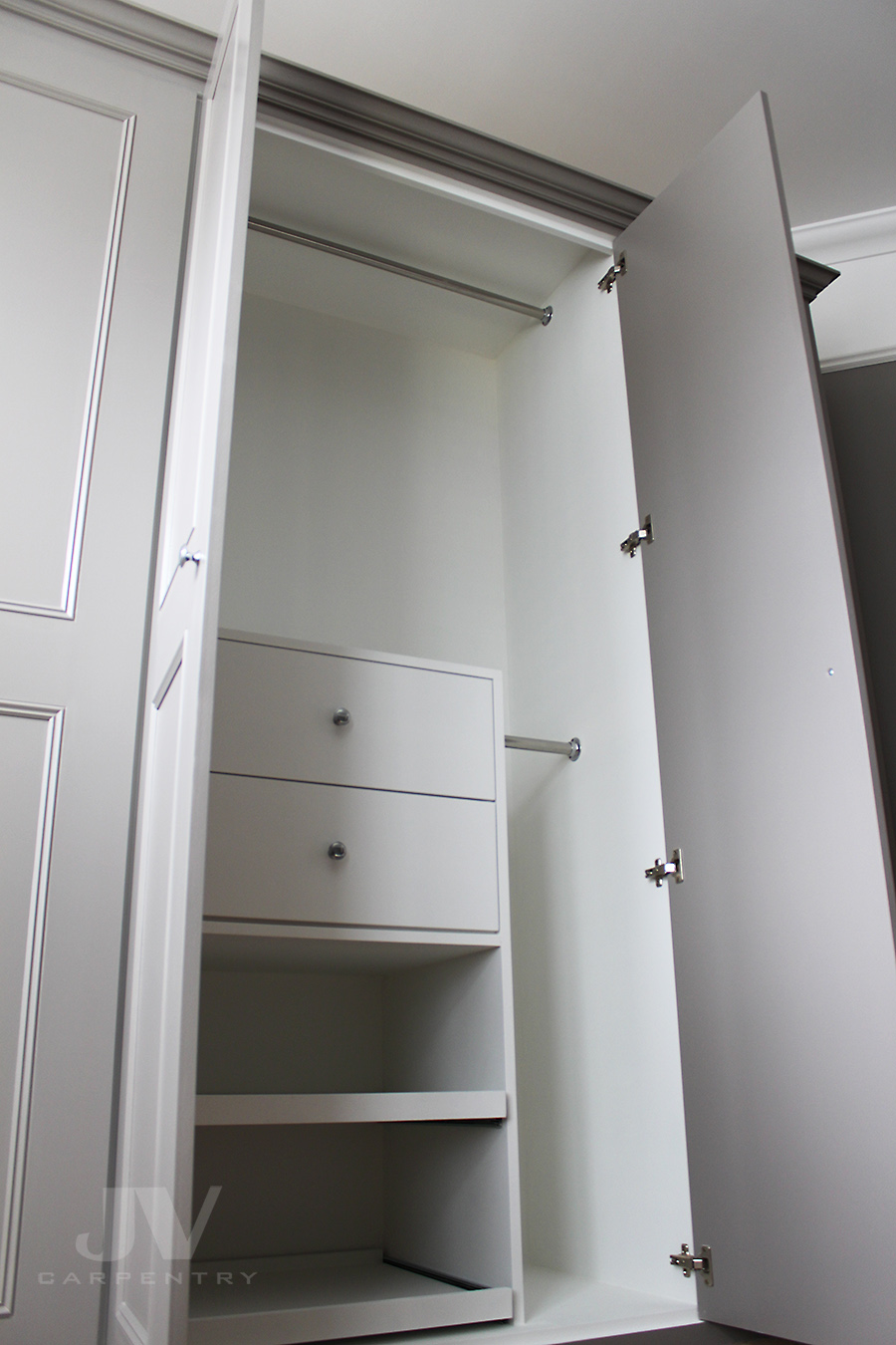 Bedroom wardrobe with drawers and shoe racks inside