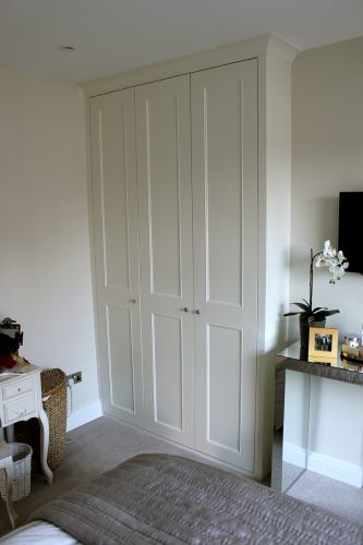 fitted wardrobe with coving and long shaker with panel mouldings doors