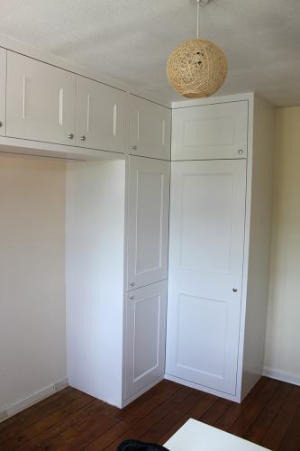 L shaped wardrobe with top cupboards