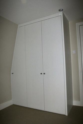 loft bedroom wardrobe with slope on the side