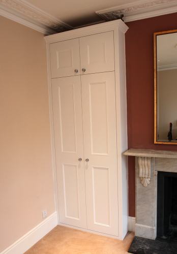 Bespoke wardrobe fitted into left alcove