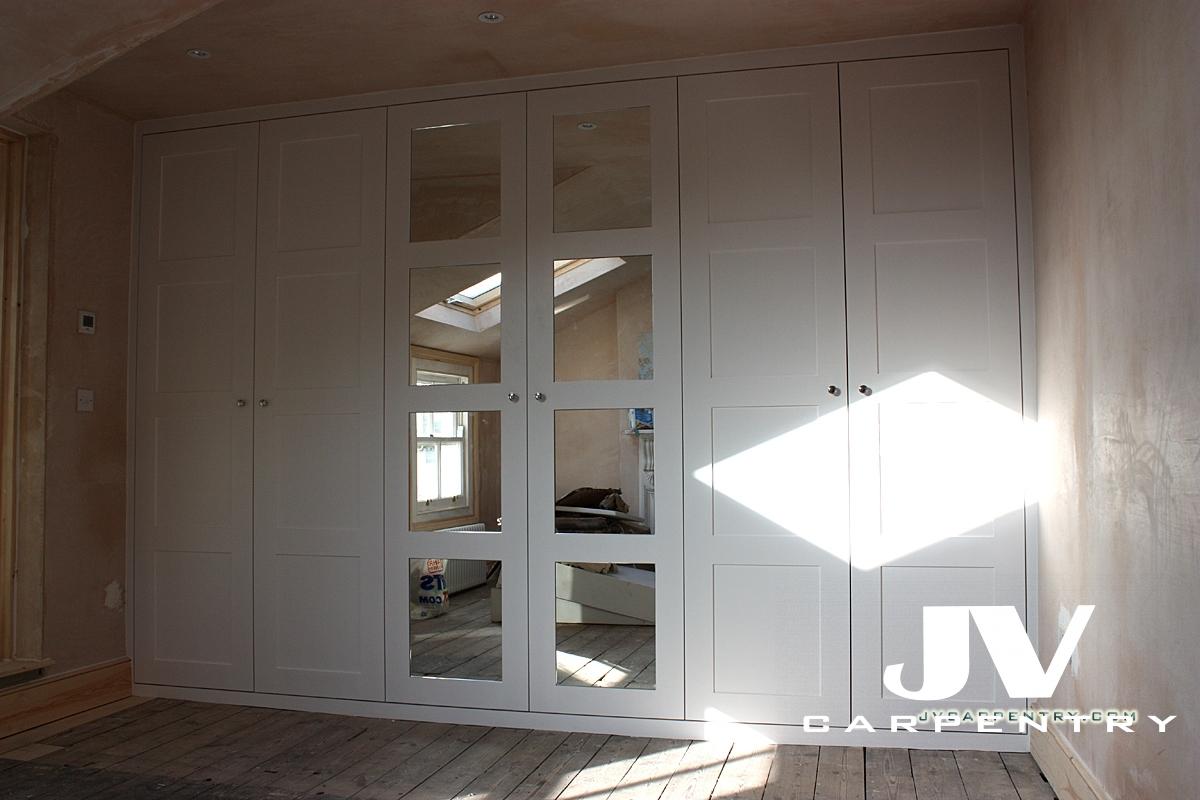 Fittes wardrobe with mirrored paneled doors