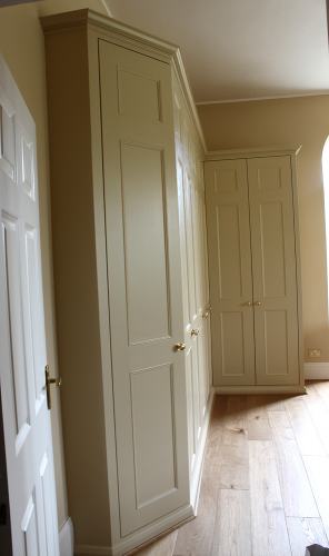 Traditional fitted wardrobe with angled door