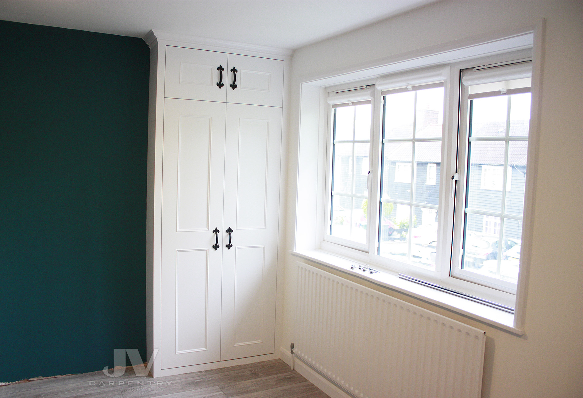fitted wardrobe close to the window