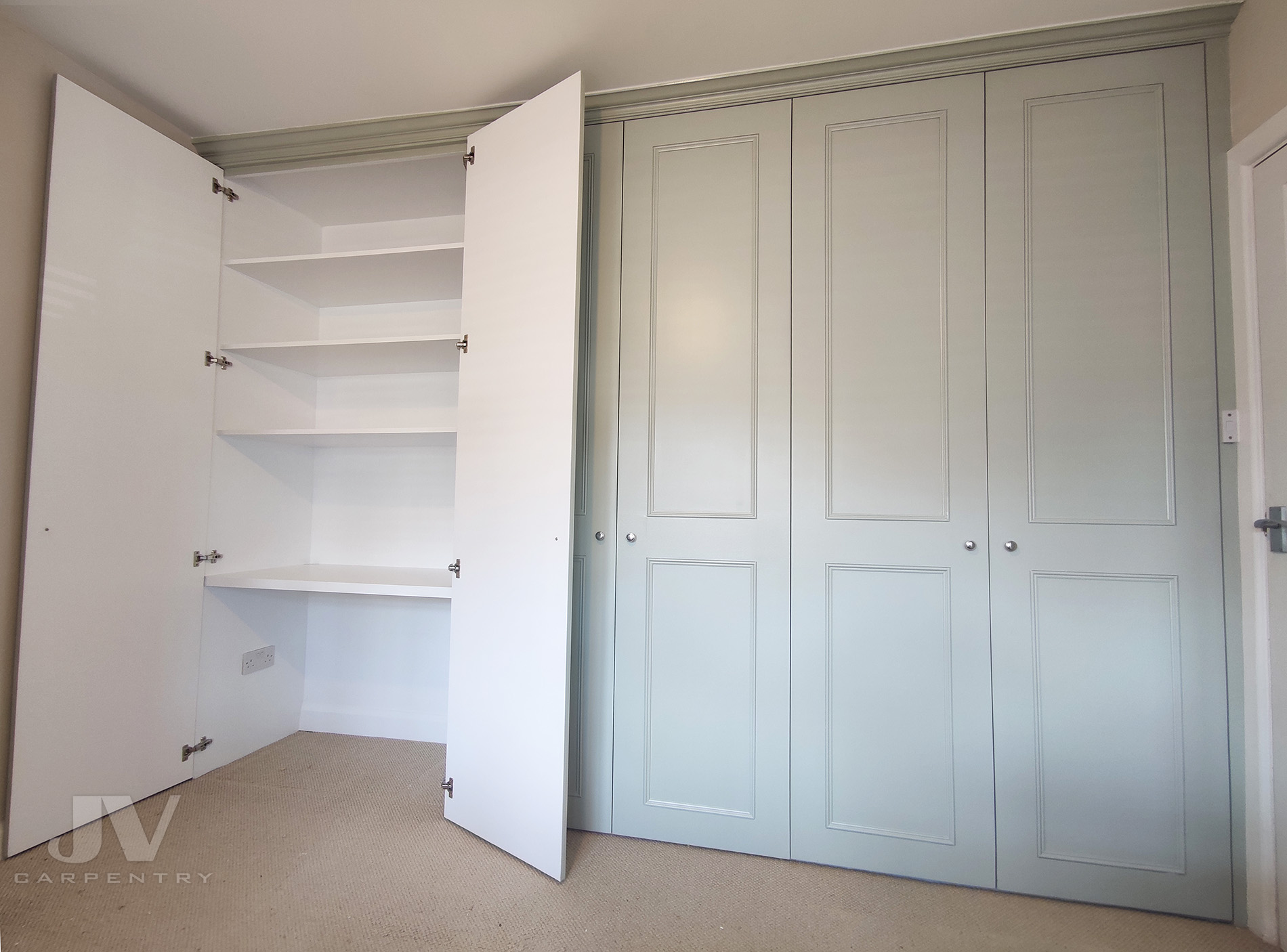 fitted wardrobe with dressing table inside